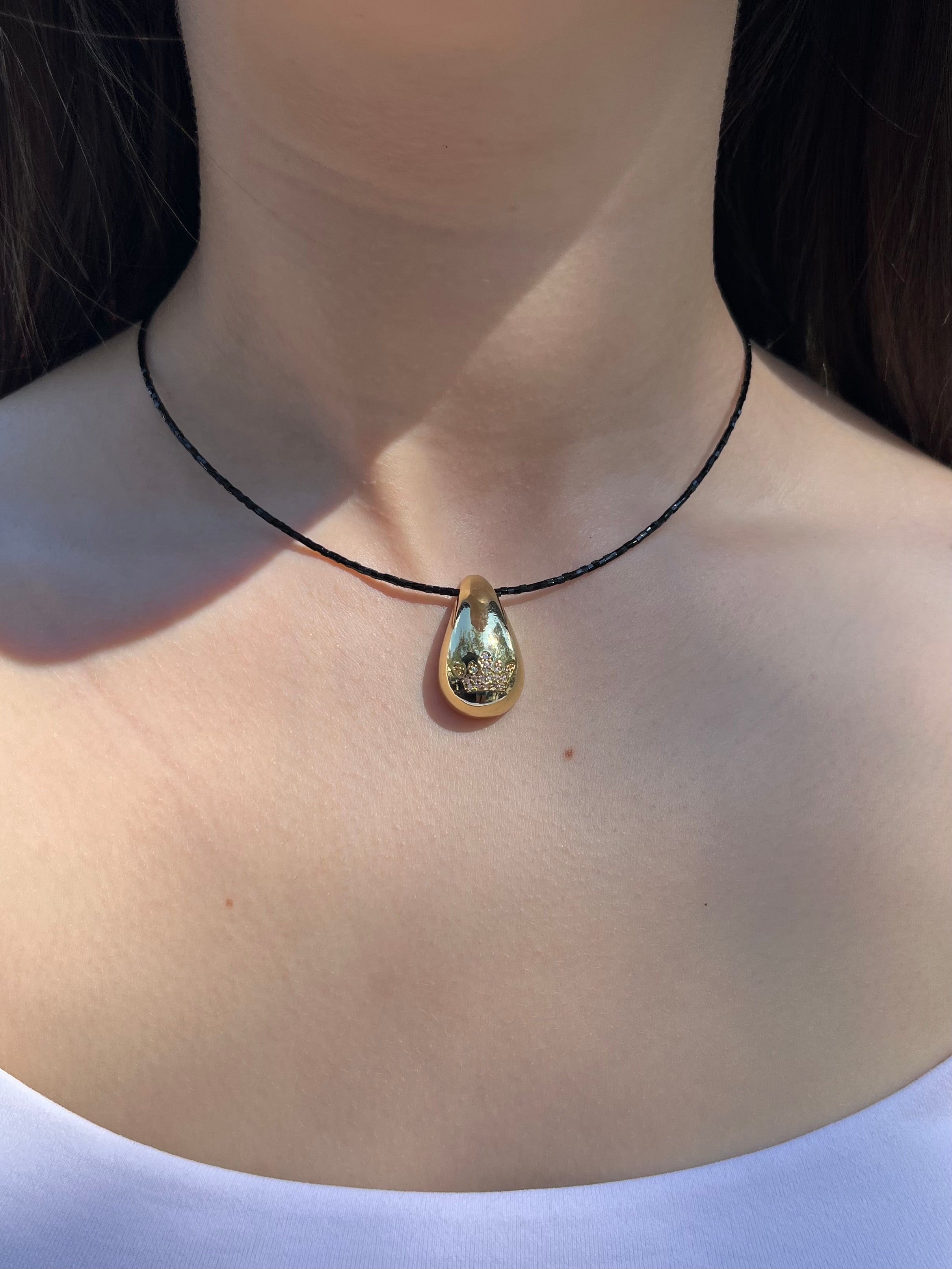 Black beaded choker with gold teardrop crown pendants: 18K Gold Plated