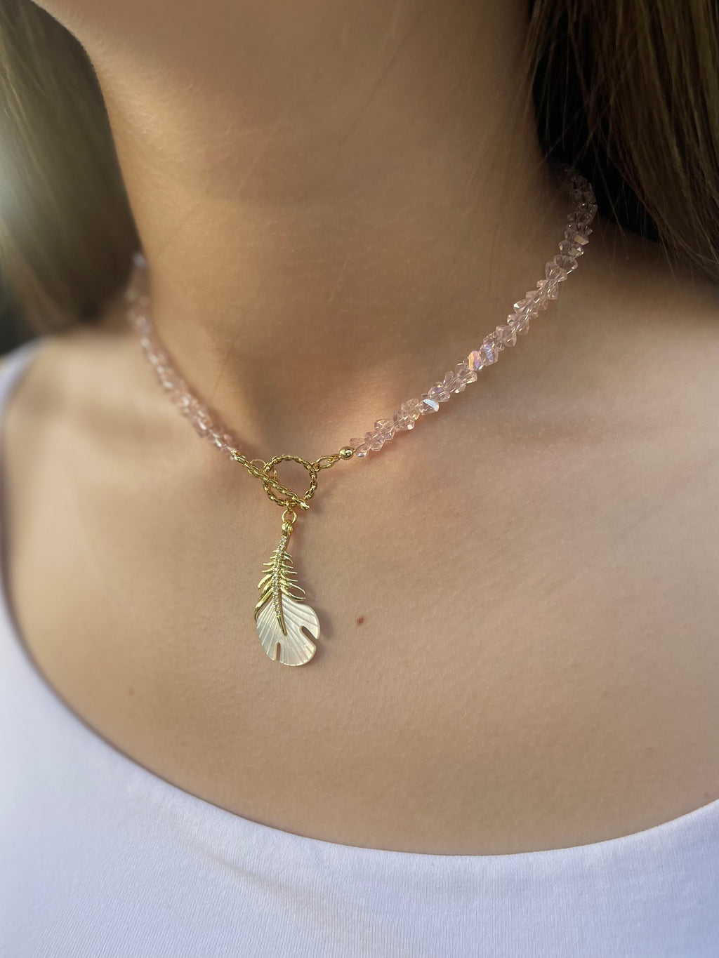 Pink crystal necklace with 14K gold Feather pendant