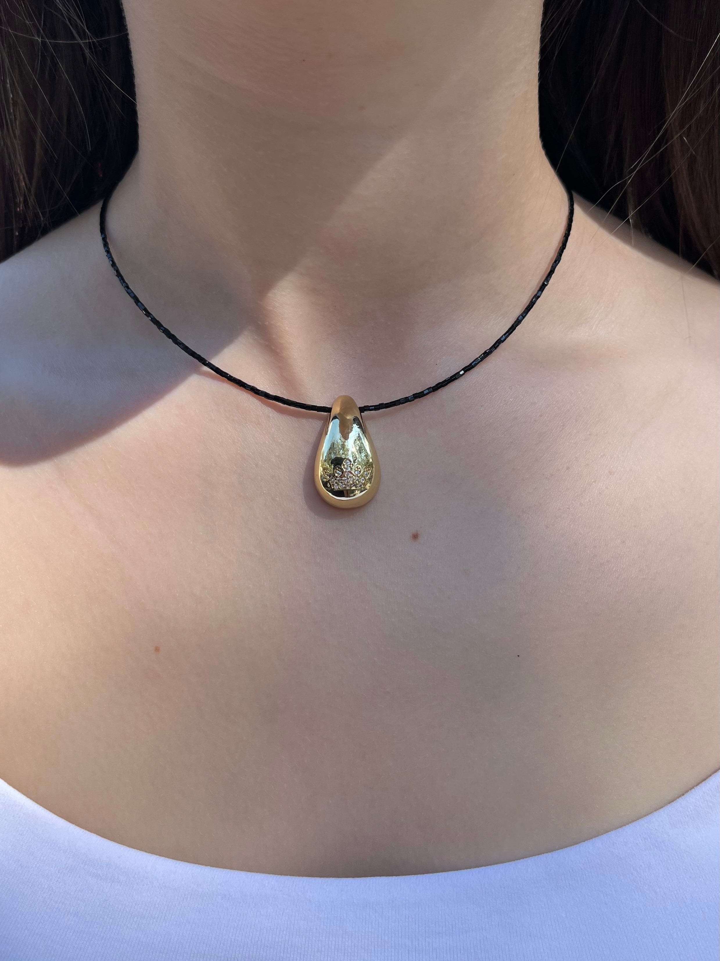 Black beaded choker with gold teardrop crown pendants: 18K Gold Plated