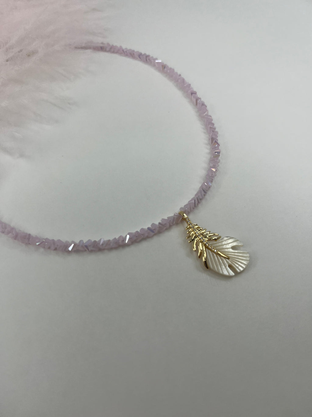 Pink crystal necklace with 14K gold Feather pendant