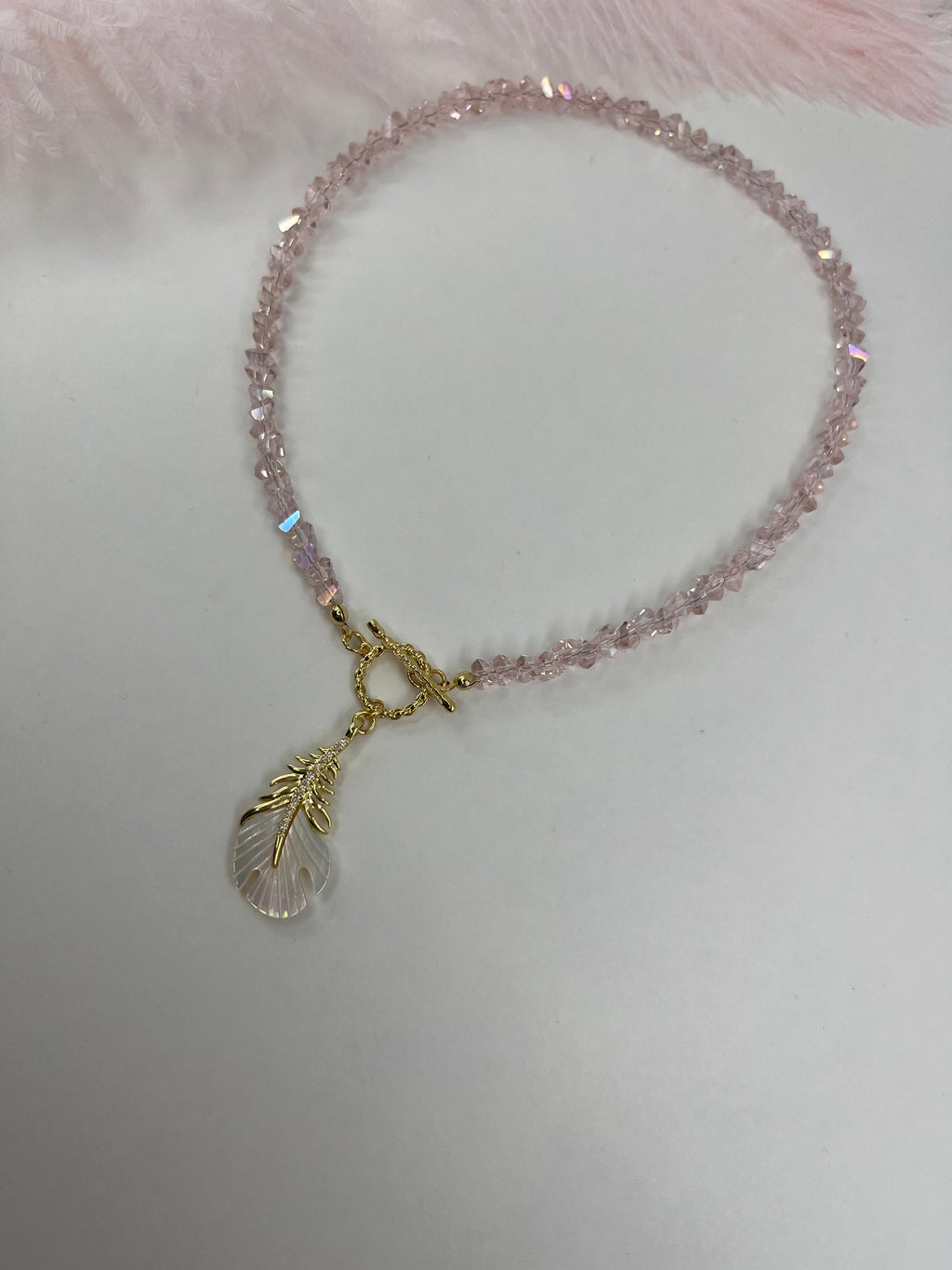 Pink crystal necklace with 14K gold Feather pendant