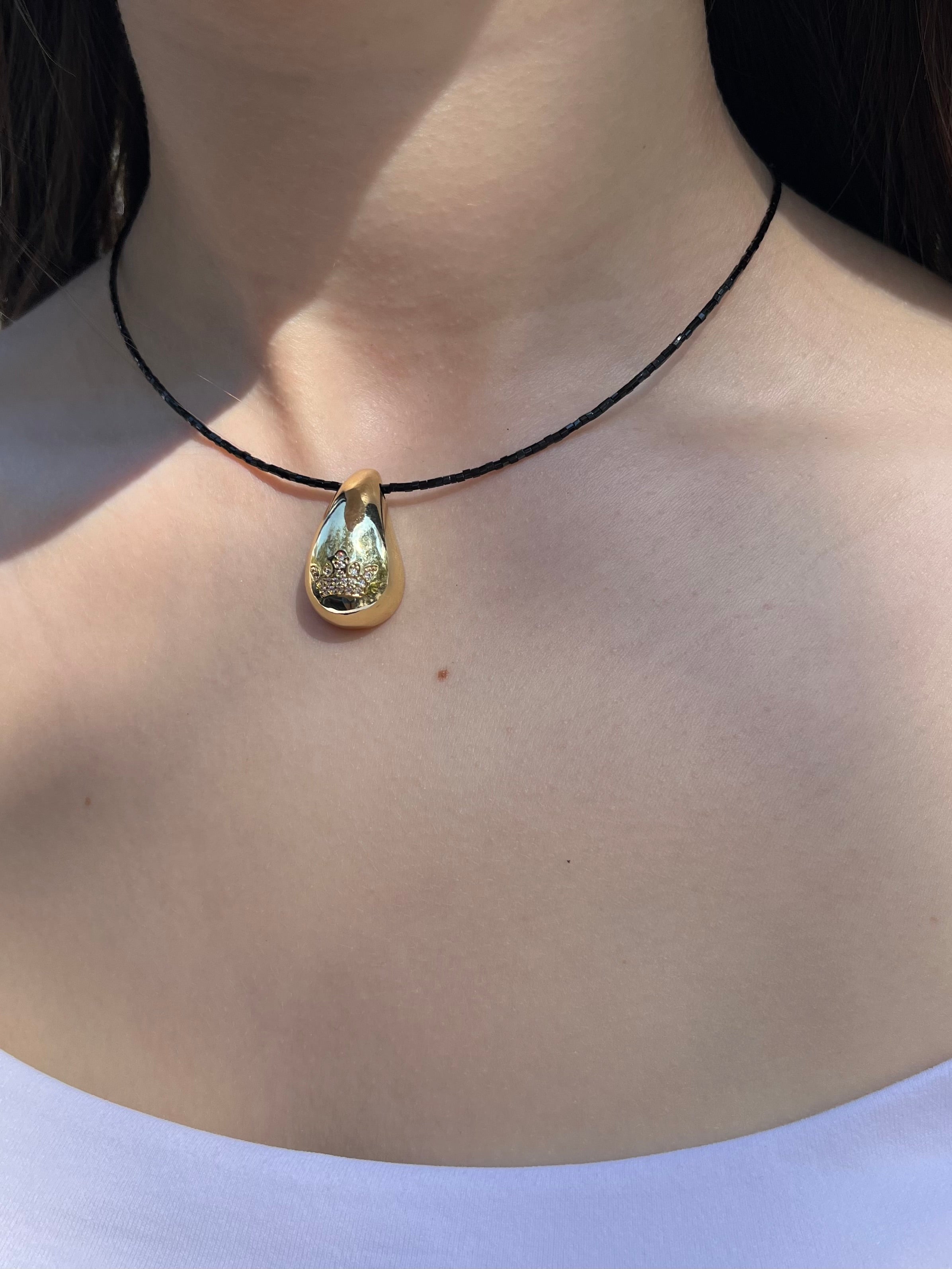Black beaded choker with gold teardrop crown pendants: 18K Gold Plated