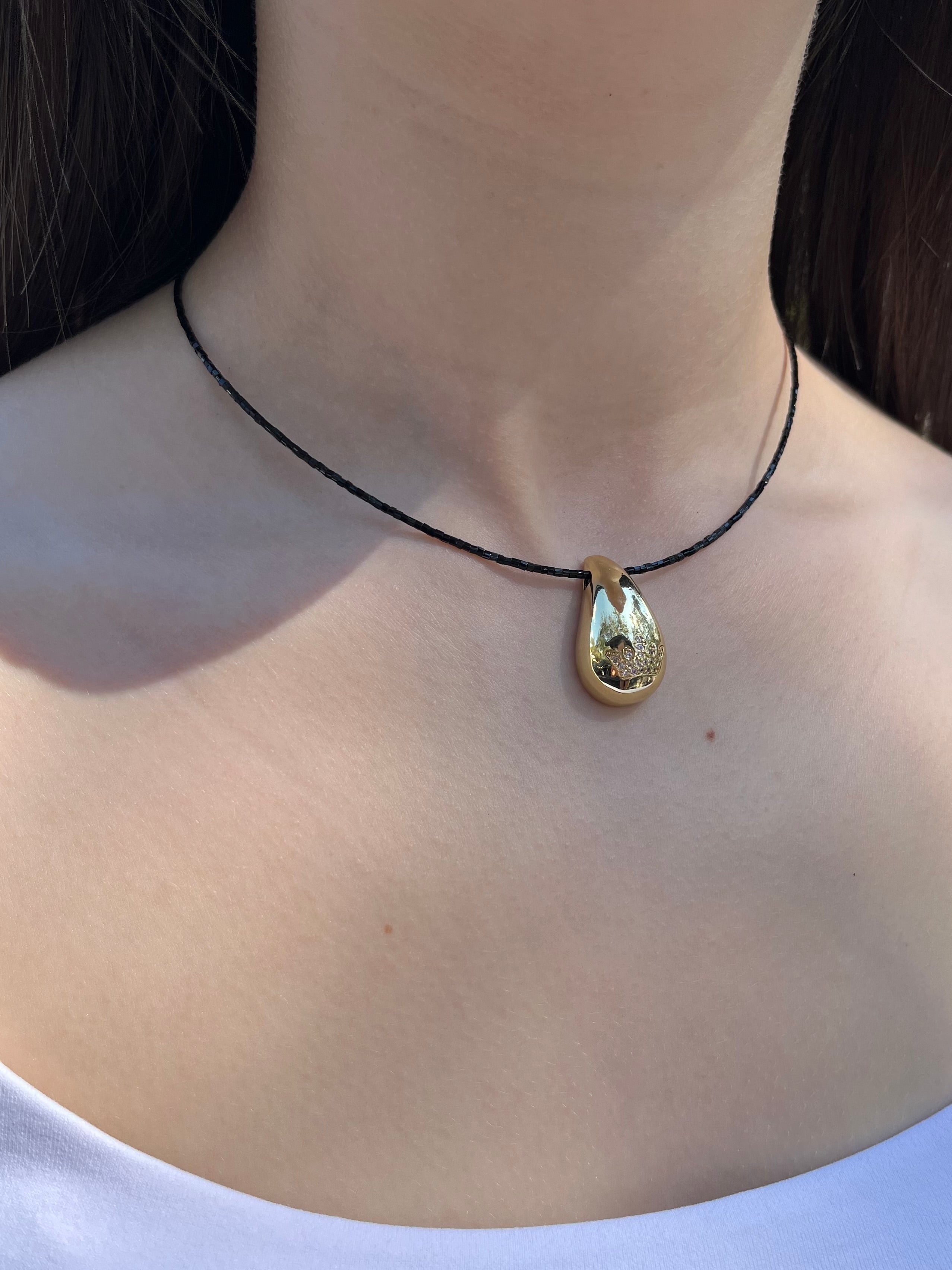 Black beaded choker with gold teardrop crown pendants: 18K Gold Plated